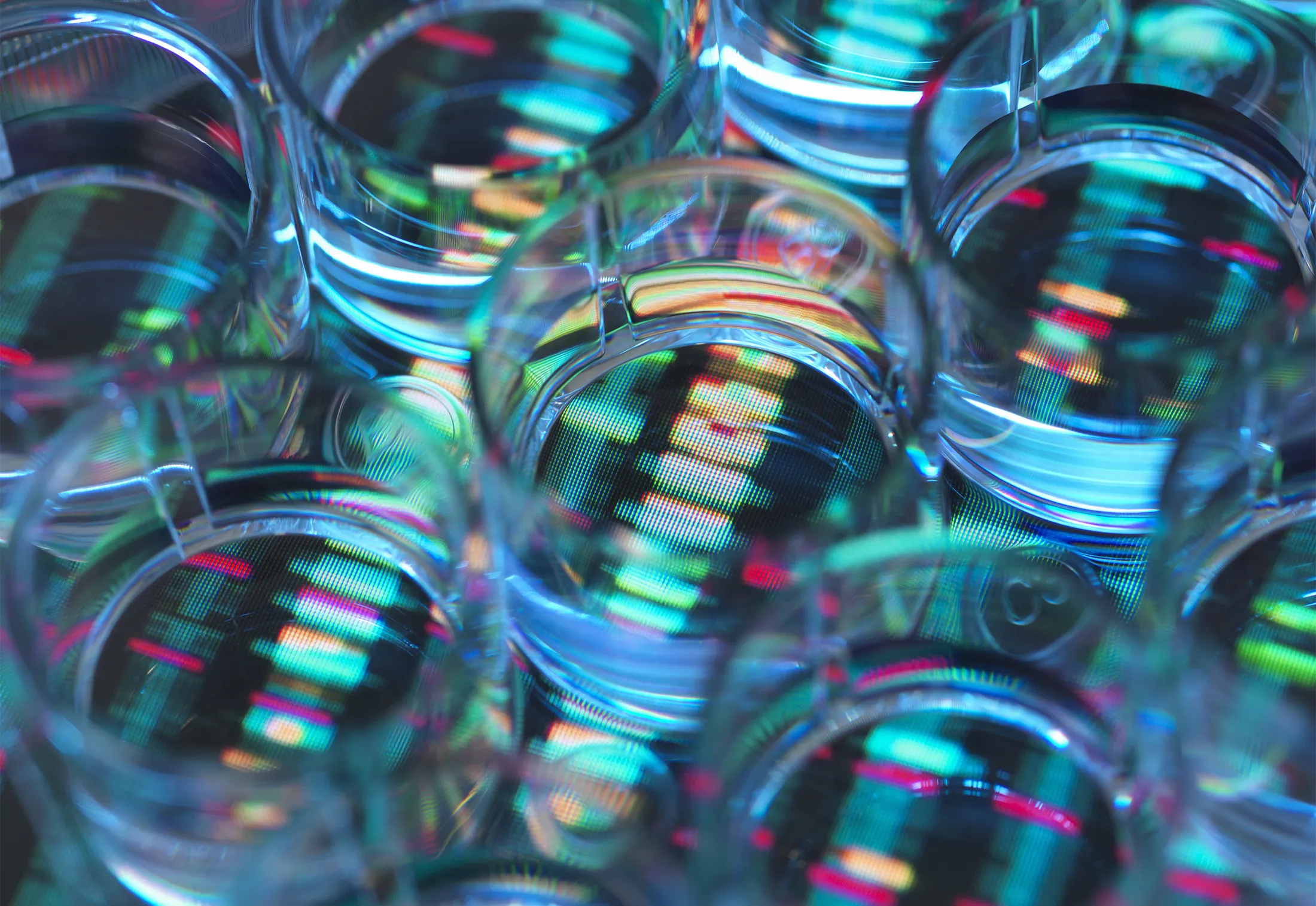 Genetic Research, A human sample in a multi well plate ready for genetic analysis with a DNA sequence in the background