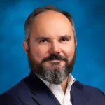 Greg Revenu at Stifel